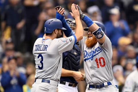 MILWAUKEE, WI – OCTOBER 13: Justin Turner #10 of the Los Angeles Dodgers celebrates with Chris Taylor #3 after hitting a two run home run against Jeremy Jeffress #32 of the Milwaukee Brewers during the eighth inning in Game Two of the National League Championship Series at Miller Park on October 13, 2018 in Milwaukee, Wisconsin. (Photo by Stacy Revere/Getty Images)