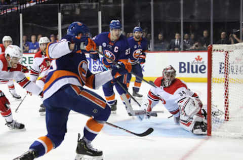 NEW YORK, NEW YORK – APRIL 26: Petr Mrazek #34 of the Carolina Hurricanes stops Brock Nelson #29 of the New York Islanders on the second period powerplay in Game One of the Eastern Conference Second Round during the 2019 NHL Stanley Cup Playoffs at the Barclays Center on April 26, 2019 in the Brooklyn borough of New York City. (Photo by Bruce Bennett/Getty Images)