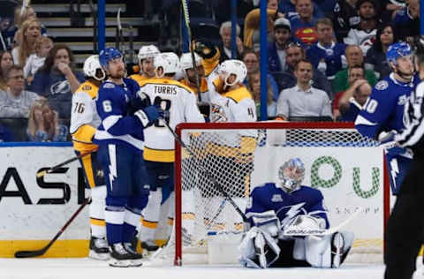 TAMPA, FL – APRIL 01: Nashville Predators left wing Filip Forsberg (9) celebrates with teammates behind the Lightning net after scoring on Tampa Bay Lightning goaltender Andrei Vasilevskiy (88) in the 2nd period of the NHL game between the Nashville Predators and Tampa Bay Lightning on April 01, 2018 at Amalie Arena in Tampa, FL. (Photo by Mark LoMoglio/Icon Sportswire via Getty Images)