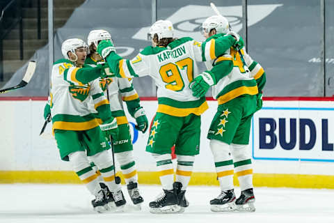 Jan 31, 2021; Saint Paul, Minnesota, USA; Minnesota Wild forward Victor Rask (49) celebrates with forward Kirill Kaprizov (97) and teammates after scoring a goal against the Colorado Avalanche during the third period at Xcel Energy Center. Mandatory Credit: Brace Hemmelgarn-USA TODAY Sports