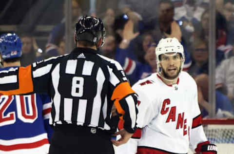 NEW YORK, NEW YORK – MAY 28: Tony DeAngelo #77 of the Carolina Hurricanes argues a call with referee Francois St. Laurent #8 in the game against the Rangers in Game Six of the Second Round of the 2022 Stanley Cup Playoffs at Madison Square Garden on May 28, 2022, in New York City. The Rangers defeated the Hurricanes 5-2. (Photo by Bruce Bennett/Getty Images)