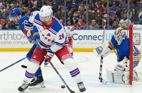 BUFFALO, NY – OCTOBER 12: Chris Kreider #20 of the New York Rangers deflects a shot as Devon Levi #27 of the Buffalo Sabres tends net, and Mattias Samuelsson #23 defends during the third period at KeyBank Center on October 12, 2023, in Buffalo, New York. (Photo by Kevin Hoffman/Getty Images)