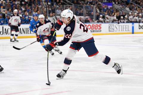 Oct 15, 2022; St. Louis, Missouri, USA; Columbus Blue Jackets defenseman Jake Bean (22) takes a shot against the St. Louis Blues during the third period at Enterprise Center. Mandatory Credit: Jeff Le-USA TODAY Sports