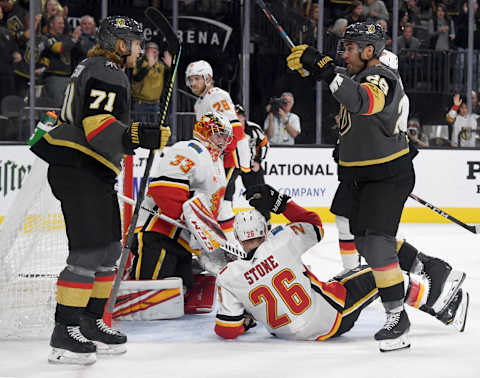 LAS VEGAS, NEVADA – OCTOBER 12: William Karlsson #71 and William Carrier #28 of the Vegas Golden Knights celebrate after Karlsson assisted Carrier on a second-period goal against David Rittich #33 of the Calgary Flames during their game at T-Mobile Arena on October 12, 2019 in Las Vegas, Nevada. (Photo by Ethan Miller/Getty Images)