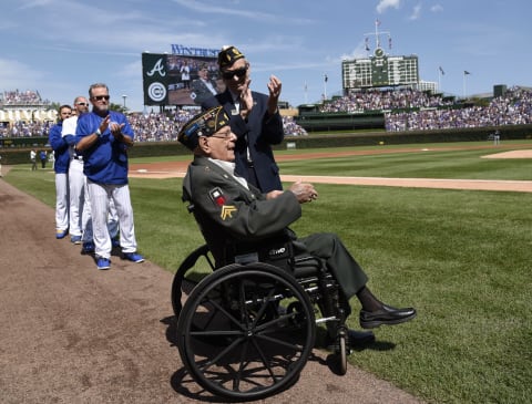 CHICAGO, IL – SEPTEMBER 03: World War II veteran Art Rento (front) is honored before the game between the Chicago Cubs and the Atlanta Braves on September 3, 2017 at Wrigley Field in Chicago, Illinois. (Photo by David Banks/Getty Images)