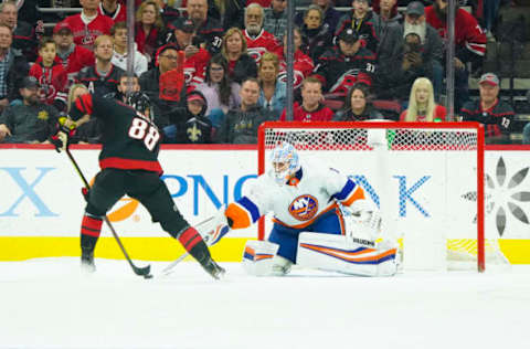 Jan 19, 2020; Raleigh, North Carolina, USA; Carolina Hurricanes center Martin Necas (88) shoot attempt is stopped by New York Islanders goaltender Thomas Greiss (1) at PNC Arena. The Carolina Hurricanes defeated the New York Islanders 2-1. Mandatory Credit: James Guillory-USA TODAY Sports