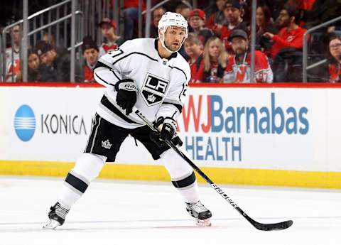 NEWARK, NEW JERSEY – FEBRUARY 08: Alec Martinez #27 of the Los Angeles Kings takes the puck in the third period against the New Jersey Devils at Prudential Center on February 08, 2020 in Newark, New Jersey.The New Jersey Devils defeated the Los Angeles Kings 3-0. (Photo by Elsa/Getty Images)