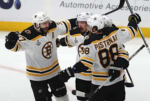 ST. LOUIS, MO – JUNE 9: Bruins Brad Marchand( c) is congratulated by Patrice Bergeron (l) and David Pastrnak after his first period goal. The St. Louis Blues host the Boston Bruins in Game 6 of the 2019 Stanley Cup Finals at Enterprise Center in St. Louis on June 9, 2019. (Photo by John Tlumacki/The Boston Globe via Getty Images)