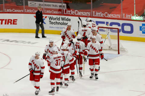 Jan 14, 2021; Detroit, Michigan, USA; Carolina Hurricanes celebrates after defeating the Detroit Red Wings at Little Caesars Arena. Mandatory Credit: Rick Osentoski-USA TODAY Sports