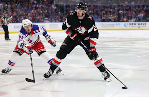 Mar 11, 2023; Buffalo, New York, USA; New York Rangers right wing Vladimir Tarasenko (91) tries to block shot by Buffalo Sabres defenseman Mattias Samuelsson (23) during the second period at KeyBank Center. Mandatory Credit: Timothy T. Ludwig-USA TODAY Sports