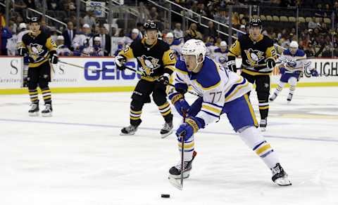 Oct 5, 2021; Pittsburgh, Pennsylvania, USA; Buffalo Sabres right wing John-Jason Peterka (77) carries the puck into the offensive zone against the Pittsburgh Penguins during the third period at PPG Paints Arena. The Penguins won 5-4 in a shootout. Mandatory Credit: Charles LeClaire-USA TODAY Sports