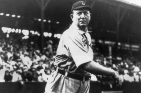 circa 1910: Full-length portrait of American baseball player Cy Young (1867 – 1955), pitcher for the Cleveland Naps, lightly tossing a ball during warm-ups while wearing his uniform. (Photo by Photo File/Getty Images)