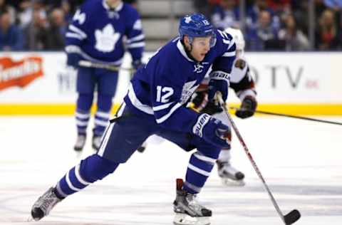 Dec 15, 2016; Toronto, Ontario, CAN; Toronto Maple Leafs forward Connor Brown (12) carries the puck against the Arizona Coyotes at Air Canada Centre. Arizona defeated Toronto 3-2 in an overtime shootout. Mandatory Credit: John E. Sokolowski-USA TODAY Sports