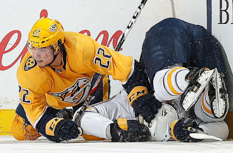 NASHVILLE, TN – MARCH 31: Kevin Fiala #22 of the Nashville Predators upends Justin Falk #41 of the Buffalo Sabres during an NHL game at Bridgestone Arena on March 31, 2018 in Nashville, Tennessee. (Photo by John Russell/NHLI via Getty Images)