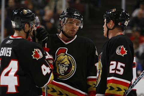 OTTAWA, CANADA – NOVEMBER 30: Linemates Patrick Eaves #44; Mike Fisher #12 and Chris Neil #25 of the Ottawa Senators discuss strategy during a TV timeout in a game against the Florida Panthers on November 30, 2006 at the Scotiabank Place in Ottawa, Canada. The Senators won 6-0. (Photo by Phillip MacCallum/Getty Images)