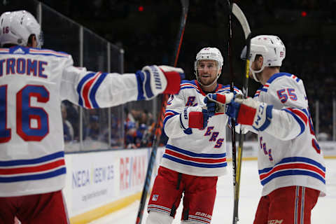 New York Rangers defenseman Brendan Smith (42) celebrates his goal against the New York Islanders with center Ryan Strome (16) and defenseman Ryan Lindgren (55) . Mandatory Credit: Brad Penner-USA TODAY Sports