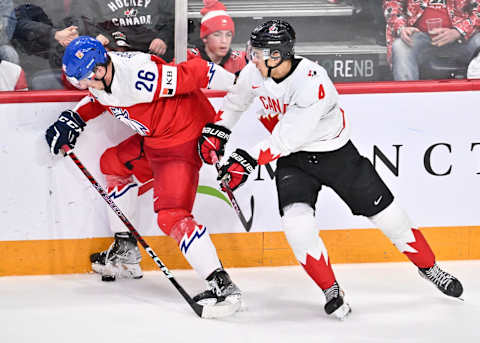 HALIFAX, CANADA – JANUARY 05: Martin Rysavy #26 of Team Czech Republic defends the puck against Tyson Hinds #4 of Team Canada during the third period in the gold medal round of the 2023 IIHF World Junior Championship at Scotiabank Centre on January 5, 2023 in Halifax, Nova Scotia, Canada. (Photo by Minas Panagiotakis/Getty Images)