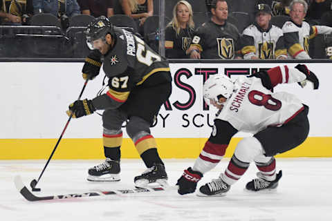 LAS VEGAS, NEVADA – SEPTEMBER 15: Max Pacioretty #67 of the Vegas Golden Knights skates with the puck against Nick Schmaltz #8 of the Arizona Coyotes in the second period of their preseason game at T-Mobile Arena on September 15, 2019 in Las Vegas, Nevada. The Golden Knights defeated the Coyotes 6-2. (Photo by Ethan Miller/Getty Images)