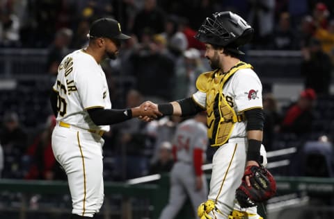 Apr 22, 2023; Pittsburgh, Pennsylvania, USA; Pittsburgh Pirates relief pitcher Duane Underwood Jr. (56) and catcher Austin Hedges (18) shake hands after defeating the Cincinnati Reds at PNC Park. The Pirates won 2-1. Mandatory Credit: Charles LeClaire-USA TODAY Sports