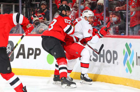 NEWARK, NJ – JANUARY 22: Christian Jaros #83 of the New Jersey Devils and Josh Leivo #41 of the Carolina Hurricanes during the National Hockey League game between the New Jersey Devils and the Carolina Hurricanes on January 22, 2022, at the Prudential Center in Newark, New Jersey. (Photo by Rich Graessle/Getty Images)