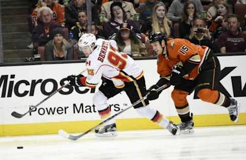 Feb 21, 2016; Anaheim, CA, USA; Calgary Flames center Sam Bennett (93) moves the puck defended by Anaheim Ducks center Ryan Getzlaf (15) during the third period at Honda Center. The Anaheim Ducks won 5-2. Mandatory Credit: Kelvin Kuo-USA TODAY Sports