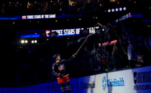 Oct 20, 2022; Columbus, Ohio, USA; Columbus Blue Jackets defenseman Nick Blankenburg (77) tosses a stick into the crowd after the game the Nashville Predators at Nationwide Arena. Mandatory Credit: Aaron Doster-USA TODAY Sports