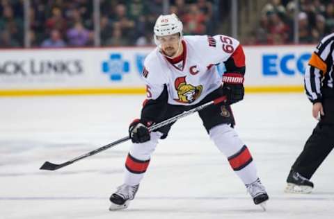 Mar 31, 2016; Saint Paul, MN, USA; Ottawa Senators defenseman Erik Karlsson (65) in the first period against the Minnesota Wild at Xcel Energy Center. the Ottawa Senators beat the Minnesota Wild 3-2. Mandatory Credit: Brad Rempel-USA TODAY Sports