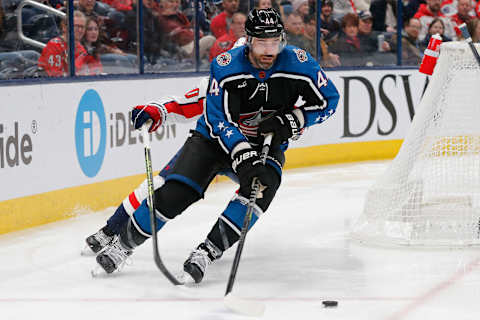 Jan 31, 2023; Columbus, Ohio, USA; Columbus Blue Jackets defenseman Erik Gudbranson (44) carries the puck as Washington Capitals center Marcus Johansson (90) trails the play during the first period at Nationwide Arena. Mandatory Credit: Russell LaBounty-USA TODAY Sports