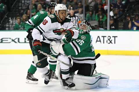 DALLAS, TX – SEPTEMBER 24: Jordan Greenway #18 of the Minnesota Wild skates into Anton Khudobin #35 of the Dallas Stars during a preseason game at American Airlines Center on September 24, 2018 in Dallas, Texas. (Photo by Ronald Martinez/Getty Images)