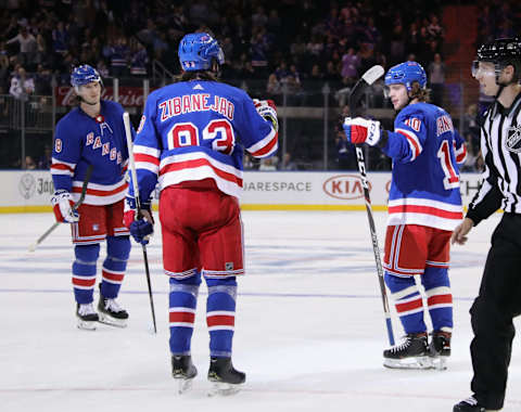 NEW YORK, NEW YORK – SEPTEMBER 18: Artemi Panarin #10 (R) of the New York Rangers celebrates his second period goal against the New Jersey Devils and is joined by Jacob Trouba #8 (L) and Mika Zibanejad #93 (C) at Madison Square Garden on September 18, 2019 in New York City. (Photo by Bruce Bennett/Getty Images)