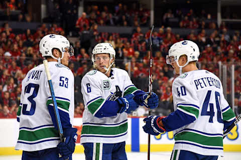 CALGARY, AB – OCTOBER 05: Vancouver Canucks Center Bo Horvat (53), Right Wing Brock Boeser (6) and Center Elias Pettersson (40) talk between whistles during the third period of an NHL game where the Calgary Flames hosted the Vancouver Canucks on October 5, 2019, at the Scotiabank Saddledome in Calgary, AB. (Photo by Brett Holmes/Icon Sportswire via Getty Images)