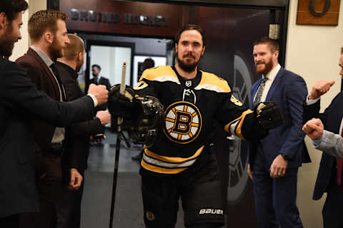 BOSTON, MA – MAY 12: Marcus Johansson #90 of the Boston Bruins fist bumps his teammates in the locker room after the win against the Carolina Hurricanes in Game Two of the Eastern Conference Final during the 2019 NHL Stanley Cup Playoffs at the TD Garden on May 12, 2019 in Boston, Massachusetts. (Photo by Steve Babineau/NHLI via Getty Images)