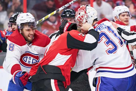 Brady Tkachuk fights with Montreal’s Carey Price and Ben Chiarot. (Photo by Jana Chytilova/Freestyle Photography/Getty Images)