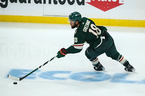 Oct 19, 2021; Saint Paul, Minnesota, USA; Minnesota Wild left wing Jordan Greenway (18) skates with the puck against the Winnipeg Jets in the third period at Xcel Energy Center. Mandatory Credit: David Berding-USA TODAY Sports