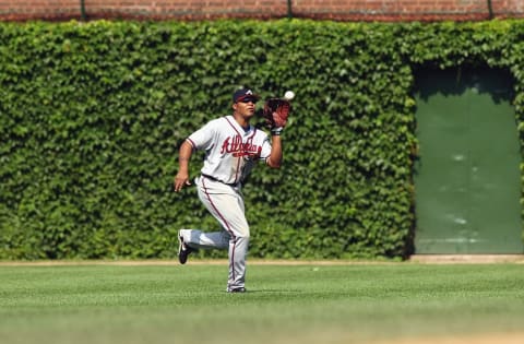 CHICAGO – JULY 10: Center fielder Andruw Jones #25 of the Atlanta Braves makes the catch during the game against the Chicago Cubs at Wrigley Field on July 10, 2003 in Chicago, Illinois. The Braves defeated the Cubs 13-3. (Photo by Jonathan Daniel/Getty Images)