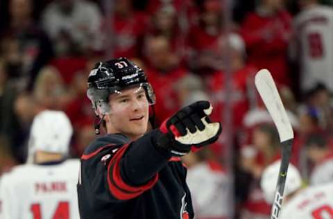 RALEIGH, NC – JANUARY 3: Andrei Svechnikov #37 of the Carolina Hurricanes points at a fan during warm ups prior o an NHL game against the Washington Capitals on January 3, 2020 at PNC Arena in Raleigh, North Carolina. (Photo by Gregg Forwerck/NHLI via Getty Images)