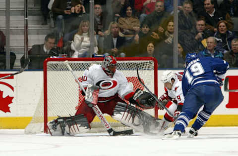 TORONTO – JANUARY 27: Kevin Weekes #80 of the Carolina Hurricanes makes a glove save on Mikael Renberg #19 of the Toronto Maple Leafs January 27, 2004 at Air Canada Centre in Toronto, Ontario, Canada. (Photo By Dave Sandford/Getty Images)