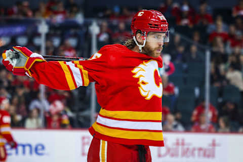 Mar 12, 2023; Calgary, Alberta, CAN; Calgary Flames defenseman Noah Hanifin (55) against the Ottawa Senators during the third period at Scotiabank Saddledome. Mandatory Credit: Sergei Belski-USA TODAY Sports