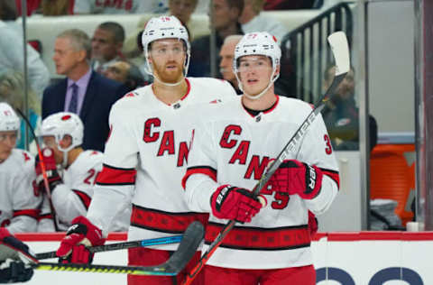 Oct 12, 2019; Raleigh, NC, USA; Carolina Hurricanes defenseman Dougie Hamilton (19) and right wing Andrei Svechnikov (37) look on against the Columbus Blue Jackets at PNC Arena. The Columbus Blue Jackets defeated the Carolina Hurricanes 3-2. Mandatory Credit: James Guillory-USA TODAY Sports