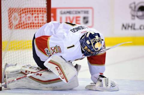 Jan 20, 2017; Vancouver, British Columbia, CAN; Florida Panthers goaltender Roberto Luongo (1) sits on the ice after a hit by the Vancouver Canucks during the first period at Rogers Arena. Mandatory Credit: Anne-Marie Sorvin-USA TODAY Sports