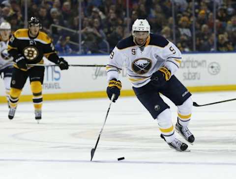 Feb 4, 2016; Buffalo, NY, USA; Buffalo Sabres left wing Evander Kane (9) heads into the Boston Bruins zone during overtime at First Niagara Center. Bruins beat the Sabres 3-2. Mandatory Credit: Kevin Hoffman-USA TODAY Sports