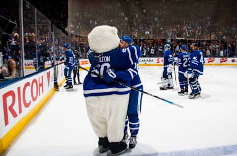 TORONTO, ON – NOVEMBER 26: Mitchell Marner #16 of the Toronto Maple Leafs hugs Carlton the Bear after defeating the Boston Bruins at the Scotiabank Arena on November 26, 2018 in Toronto, Ontario, Canada. (Photo by Mark Blinch/NHLI via Getty Images)