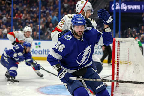 TAMPA, FL – MAY 23: Nikita Kucherov #86 of the Tampa Bay Lightning reacts to a check from Maxim Mamin #98 of the Florida Panthers during the second period in Game Four of the Second Round of the 2022 Stanley Cup Playoffs at Amalie Arena on May 23, 2022 in Tampa, Florida. (Photo by Mike Carlson/Getty Images)