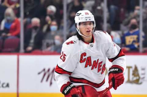 MONTREAL, QC – OCTOBER 21: Ethan Bear #25 of the Carolina Hurricanes skates against the Montreal Canadiens during the first period at Centre Bell on October 21, 2021, in Montreal, Canada. The Carolina Hurricanes defeated the Montreal Canadiens 4-1. (Photo by Minas Panagiotakis/Getty Images)