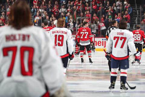 CHICAGO, IL – OCTOBER 20: Kirby Dach #77 of the Chicago Blackhawks stands with the starting line-up during the game against the Washington Capitals at the United Center on October 20, 2019 in Chicago, Illinois. (Photo by Chase Agnello-Dean/NHLI via Getty Images)