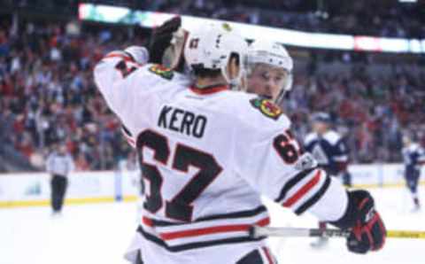 NHL Trade Deadline: Chicago Blackhawks forward Tanner Kero (67) celebrates with forward Jonathan Toews (19) after scoring a goal on an empty net during the third period at Pepsi Center. The Blackhawks won 6-4. Mandatory Credit: Chris Humphreys-USA TODAY Sports