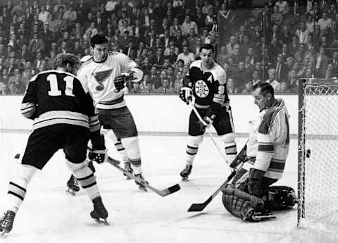 BOSTON, MA – OCTOBER 24: A shot by Boston Bruins’ Bobby Orr, not pictured, gets past St. Louis Blues goalie Glenn Hall as Boston Bruins’ Tom Williams, left, and John Bucyk look on. The Boston Bruins host the St. Louis Blues in a regular season NHL hockey game at the Boston Garden on Oct. 24, 1968. (Photo by Dan Goshtigian/The Boston Globe via Getty Images)