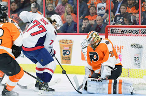 Feb 22, 2017; Philadelphia, PA, USA; Washington Capitals right wing T.J. Oshie (77) shoots the puck against Philadelphia Flyers goalie Michal Neuvirth (30) during the first period at Wells Fargo Center. Mandatory Credit: Eric Hartline-USA TODAY Sports