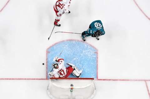 SAN JOSE, CA – OCTOBER 16: An overhead view as Brent Burns #88 of the San Jose Sharks battles in front of the net against James Reimer #47 of the Carolina Hurricanes at SAP Center on October 16, 2019 in San Jose, California. (Photo by Brandon Magnus/NHLI via Getty Images)