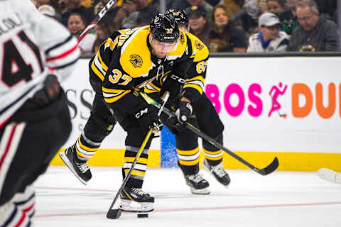 BOSTON – SEPTEMBER 28: Boston Bruins center Patrice Bergeron (37) moves to shoot the puck. The Boston Bruins host the Chicago Blackhawks in their final pre-season NHL hockey game at TD Garden in Boston on Sep. 28, 2019. (Photo by Nic Antaya for The Boston Globe via Getty Images)